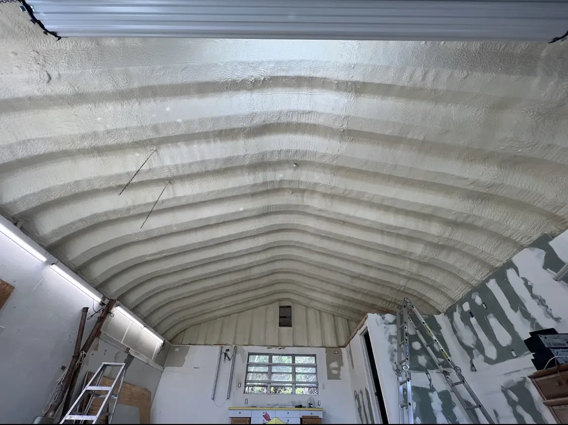 Spray polyurethane foam applied to the underside of a metal roof deck in North Mankato